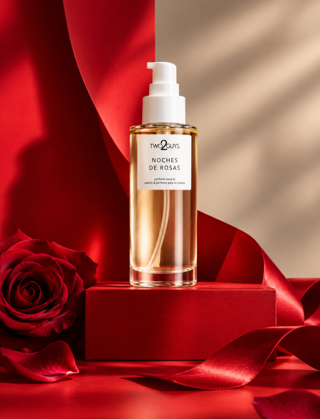 A bottle of Two Faces Noches de Rosas hair oil with a white pump, set on a red block with a red rose and red ribbon in a warm, dramatic red and beige setting.