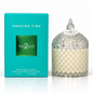 A Two Guys 'Amazing Time' vegan scented candle in a clear diamond-cut glass jar with a lid, shown next to its bright turquoise packaging box on a white background.